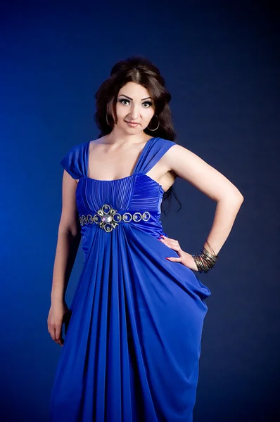 Beautiful young woman in blue dress — Stock Photo, Image