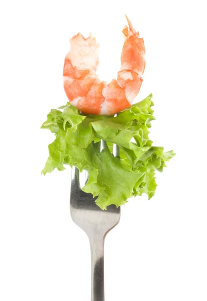Tasty prawn and green salad in a fork ready to eat on white background — Stock Photo, Image