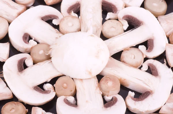 Fresh mushrooms champignon on plate — Stock Photo, Image