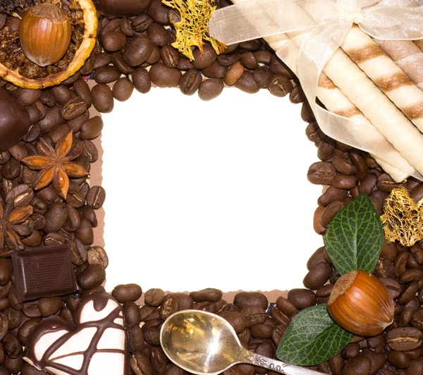 Coffee beans and sweetnesses in frame — Stock Photo, Image