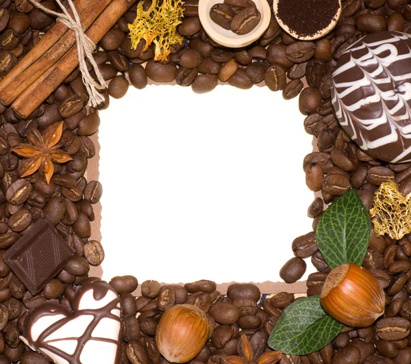 Kaffeebohnen und Süßes im Rahmen — Stockfoto