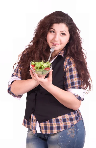 Vacker flicka äter hälsosam mat på den vita bakgrunden — Stockfoto