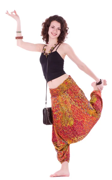 Hippie young woman doing yoga exercise on white background — Stock Photo, Image