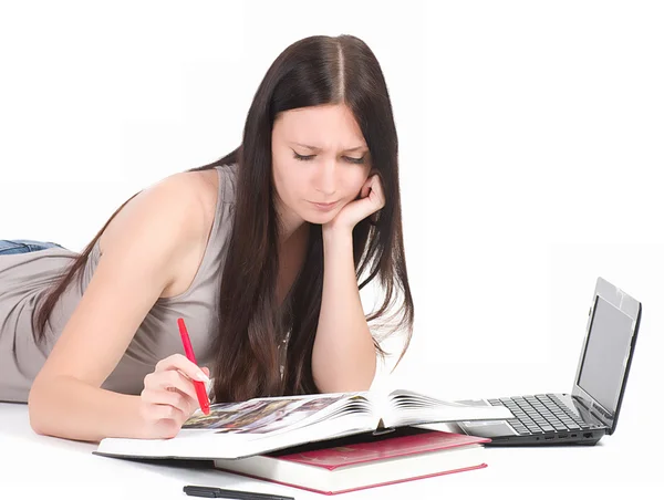 Young female student with computer and book — Stock Photo, Image