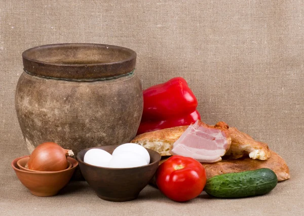 Clay pot, vegetables, oil and meat pork — Stock Photo, Image
