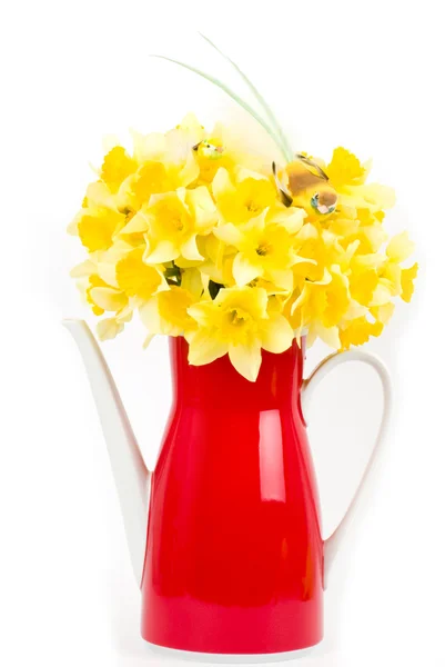 Beautiful spring flowers and bird in a red teapot — Stock Photo, Image