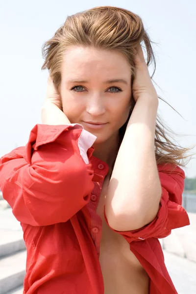 Beautiful girl in red shirt — Stock Photo, Image