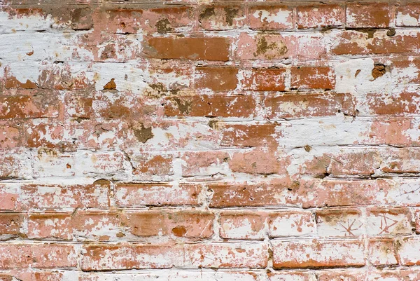 stock image Flaked-off whitewashed brick wall