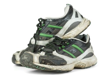 Pair of worn sneakers clipart