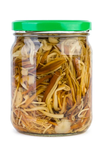 Glass jar with marinated enokitake mushrooms — Stock Photo, Image