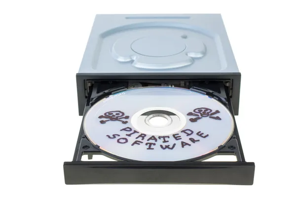 Optical disk drive with disk, containing pirated software — Stock Photo, Image