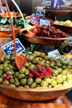 Olives for sale at a market clipart