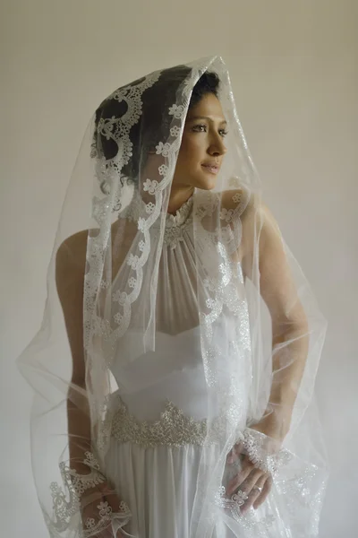 Portrait of a beautiful woman dressed as a bride — Stock Photo, Image