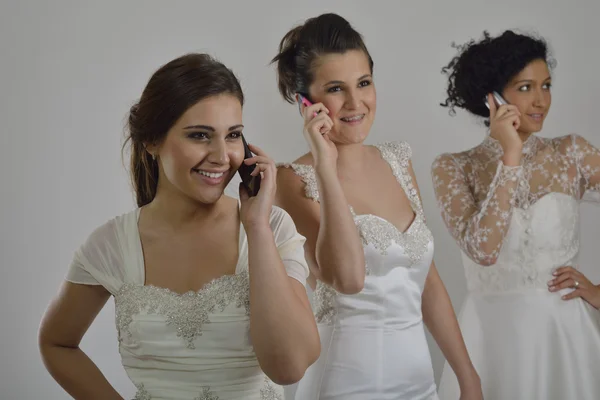 Portret van een drie mooie vrouw in trouwjurk — Stockfoto