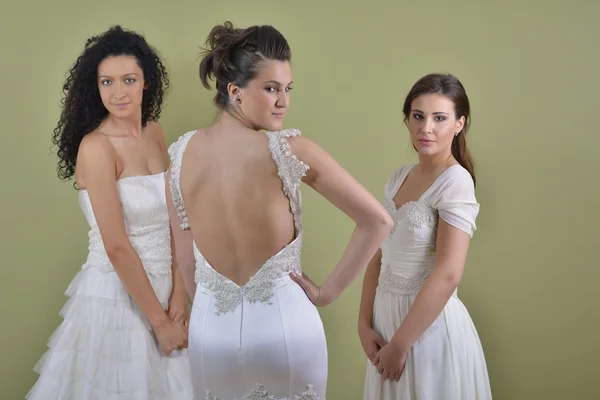 Retrato de uma mulher bonita três em vestido de noiva — Fotografia de Stock