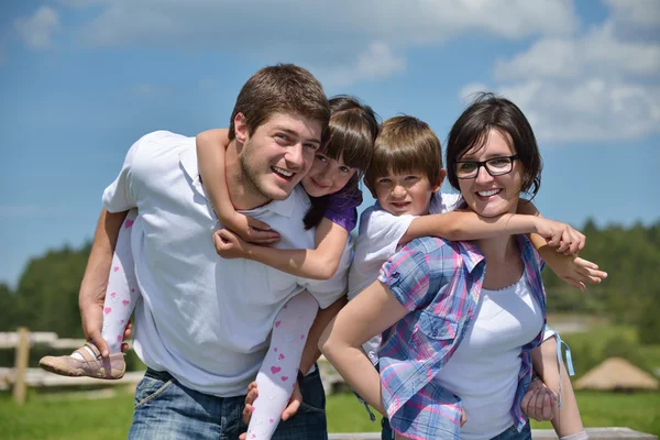 Happy young family have fun outdoors Stock Image