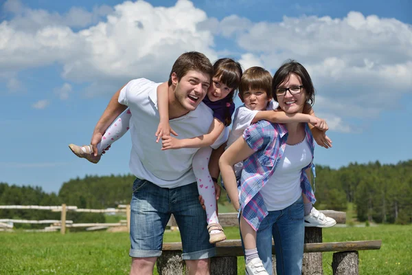 Happy young family have fun outdoors Royalty Free Stock Photos