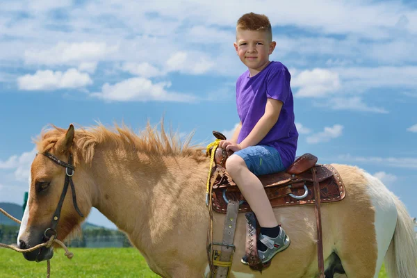 Child ride pony — Stock Photo, Image