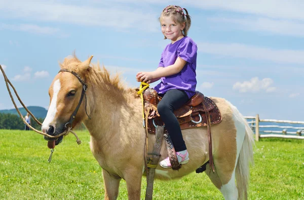 Child ride pony — Stock Photo, Image