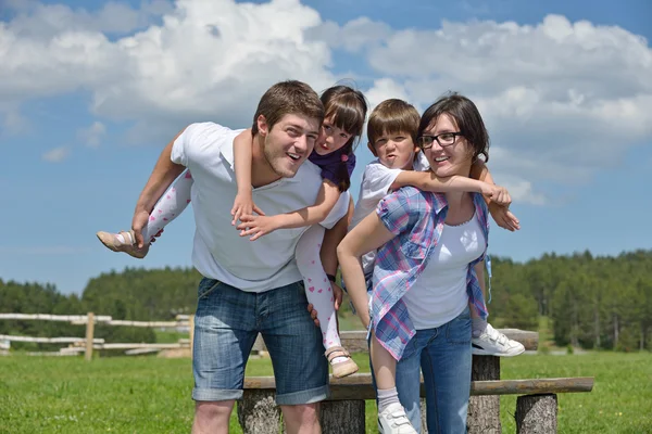 Happy young family have fun outdoors Stock Photo