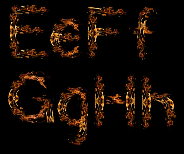 Portakal yangın harfler izole siyah — Stok fotoğraf