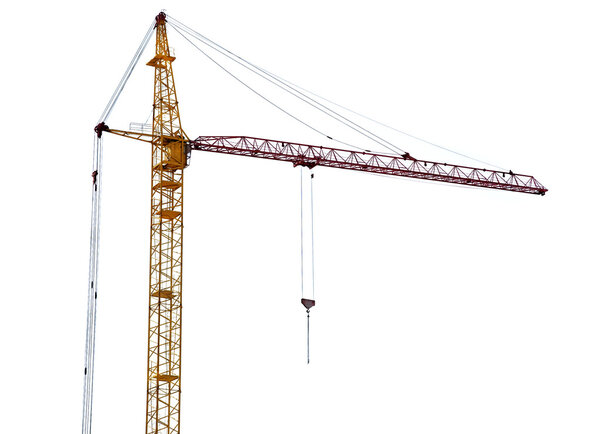 Yellow hoisting crane with pink boom