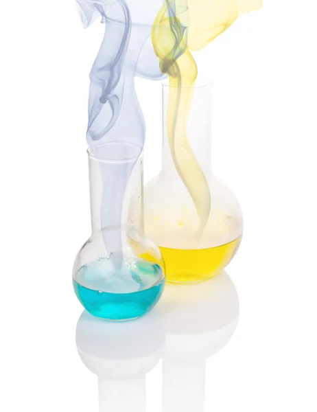 Yellow and blue chemical liquid with smoke — Stock Photo, Image