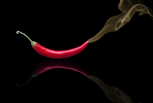 Red hot chilli pepper with smoke — Stock Photo, Image