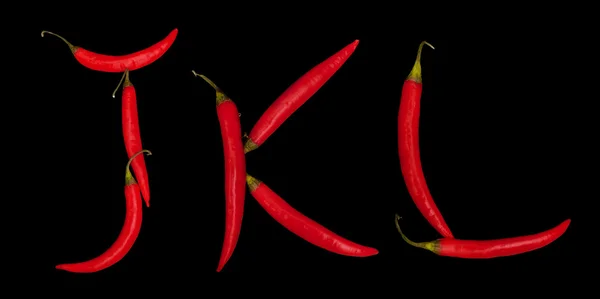 stock image Letters from chili peppers isolated on black