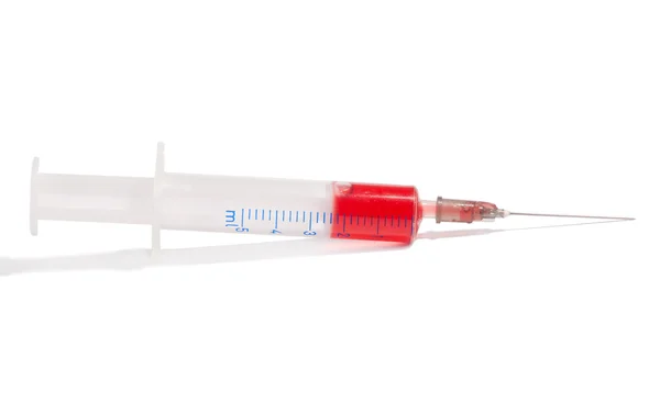 stock image Syringe with red medication on white