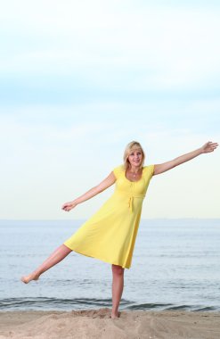 Romantic Beautiful smiling girl yellow dress