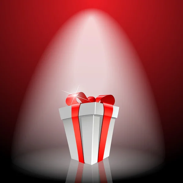 Caja de regalo con lazo rojo en la luz — Foto de Stock
