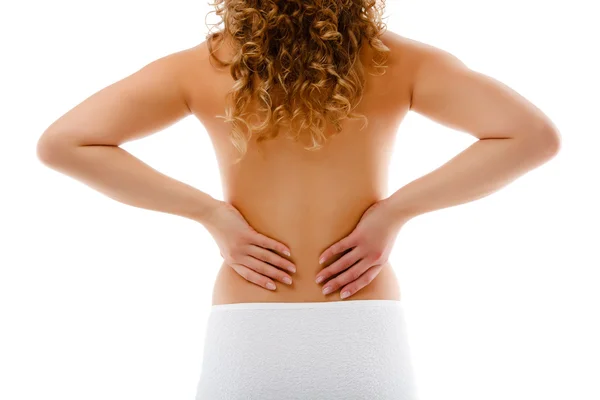 Mulher massageando dor de volta isolado no fundo branco — Fotografia de Stock