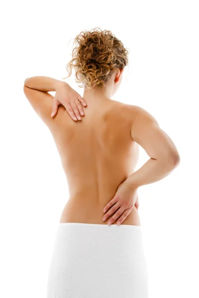 Žena masážní bolesti zpět izolované na bílém pozadí — Stock fotografie