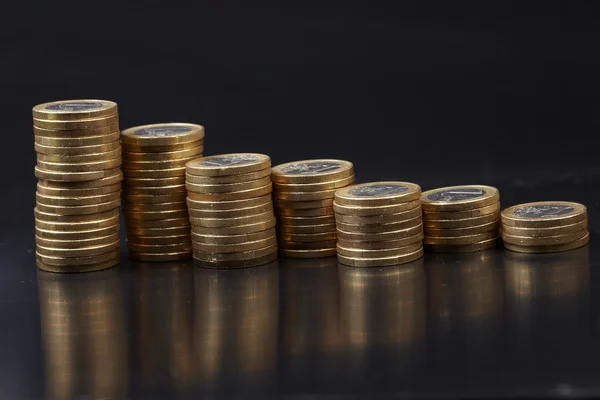 stock image Coins on the black background