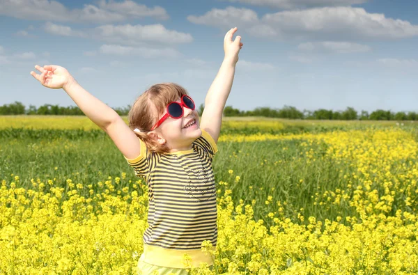 Happy little girl hands up — Stock Photo, Image