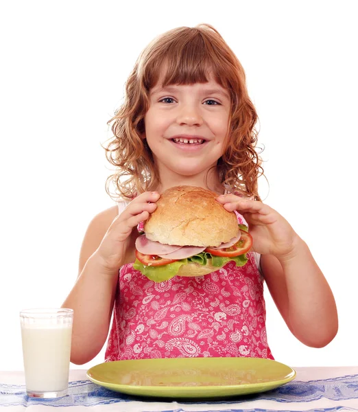 Happy little girl with big sandwich — Stock Photo, Image