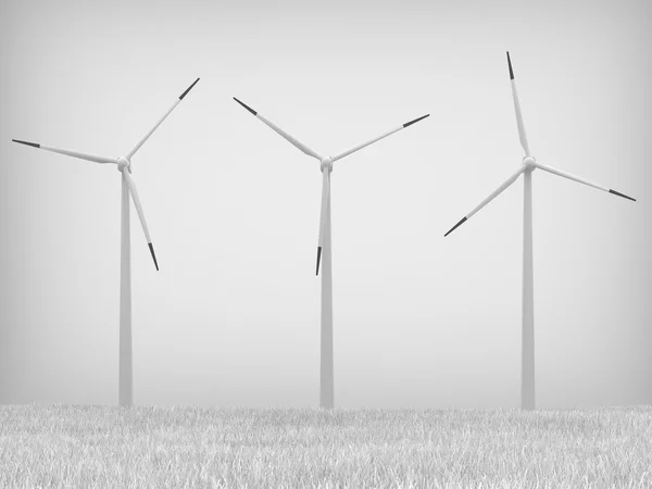 Ветряные турбины на сером фоне — стоковое фото