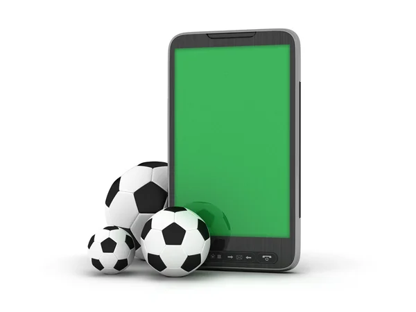 Pelotas de fútbol y teléfono móvil —  Fotos de Stock