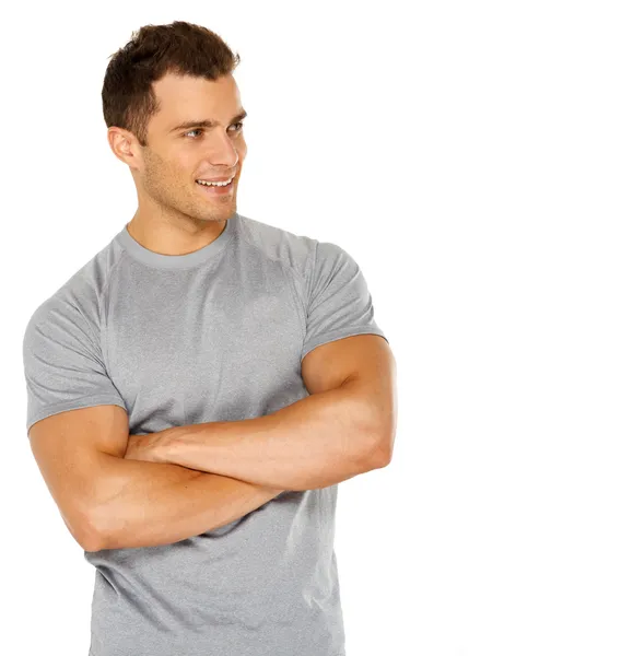 Handsome man with arms crossed looking his left on white — Stock Photo, Image