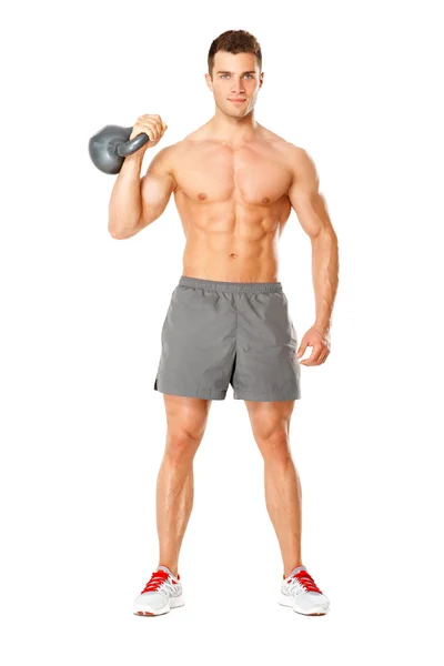 Joven musculoso levantando pesas en blanco — Foto de Stock