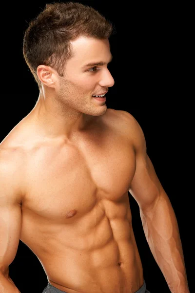Retrato de um atleta masculino muscular em preto — Fotografia de Stock