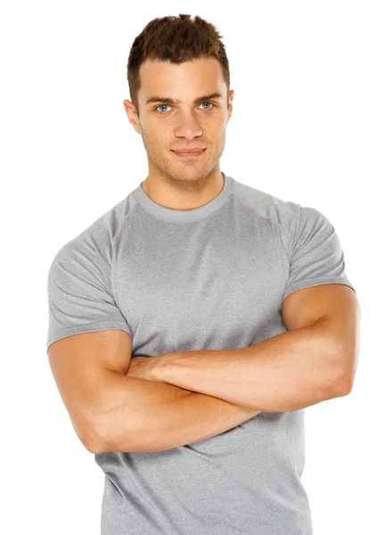 Happy fit male posing over white background — Stockfoto