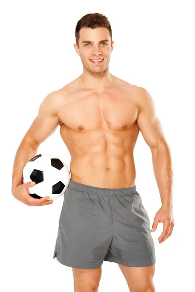 Hombre guapo sosteniendo pelota de fútbol en blanco — Foto de Stock