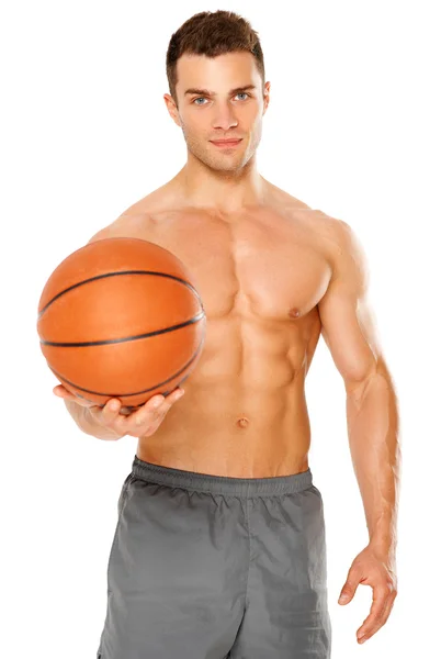 Bonito jogador de basquete segurando bola no branco — Fotografia de Stock