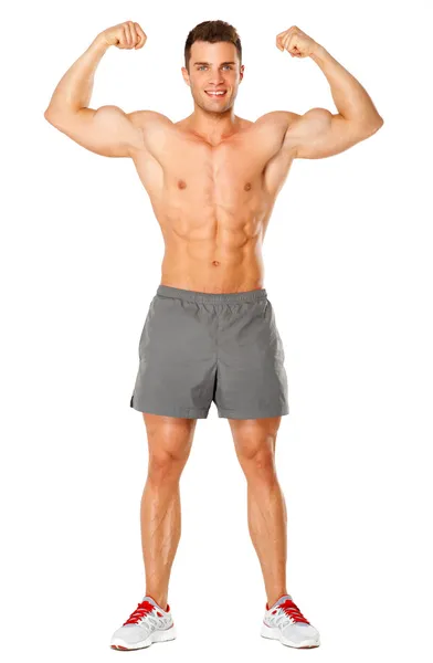 Corpo inteiro de homem musculoso flexionando o bíceps em branco — Fotografia de Stock
