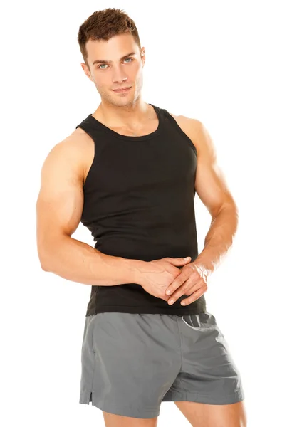 Здоровый мускулистый молодой человек, изолированный на белом — стоковое фото