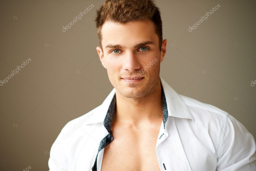 Close up of sporty man posing in white shirt — Stock Photo © dashek ...