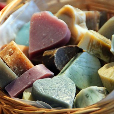 Basket of handmade soap displayed in a market clipart