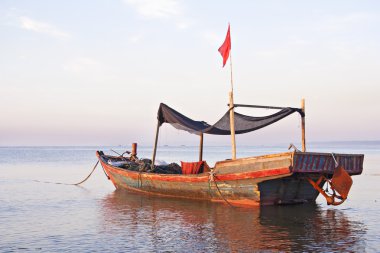 Morning on the yellow sea. Fishing boats are at sea.